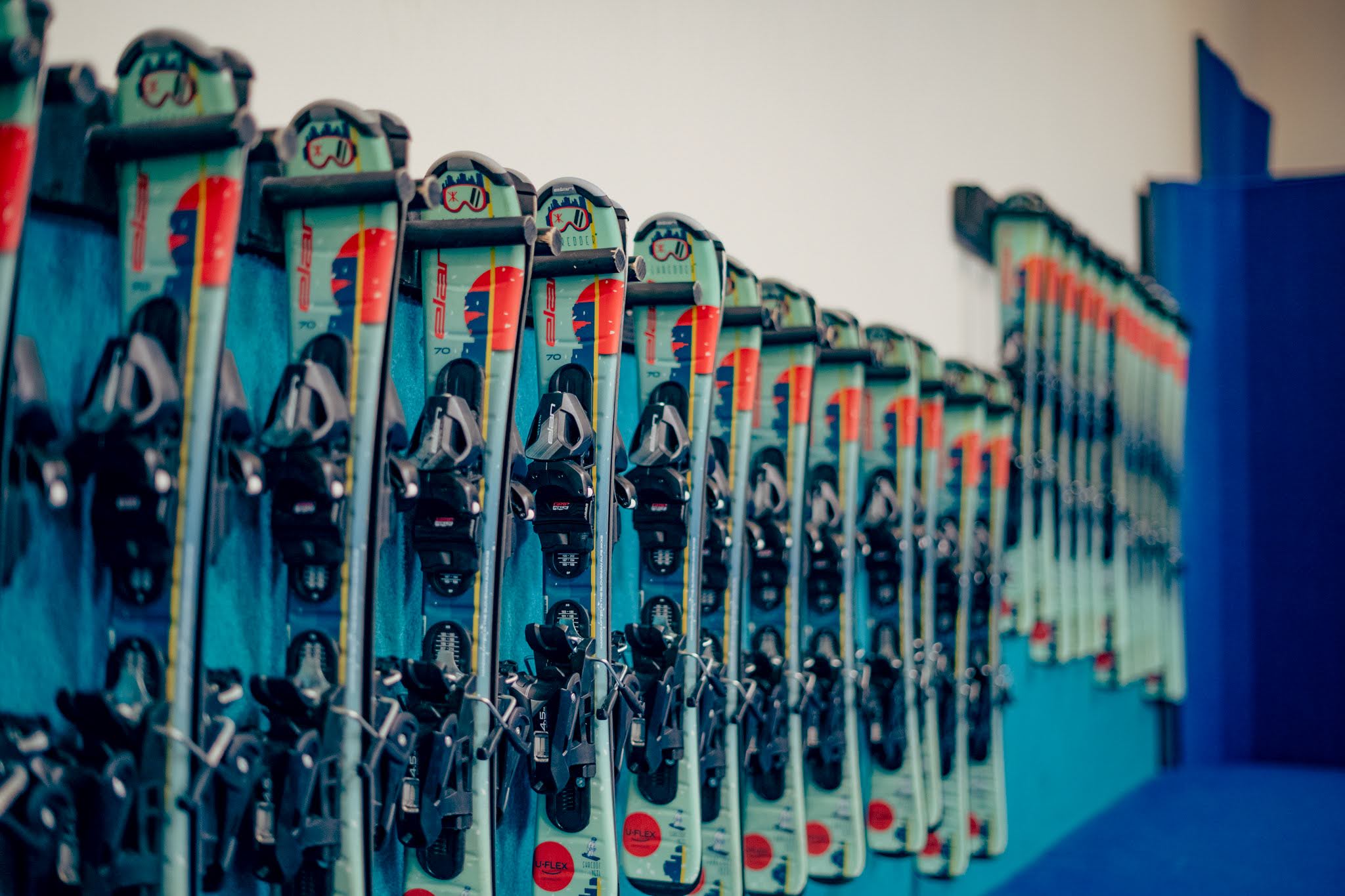 Shredder gear wall with helmets and ski boots